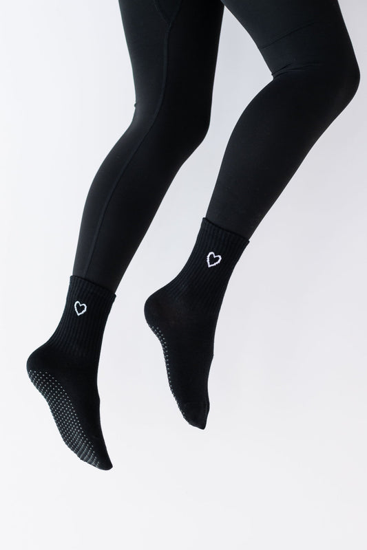 Black tights with a subtle pattern on a white background